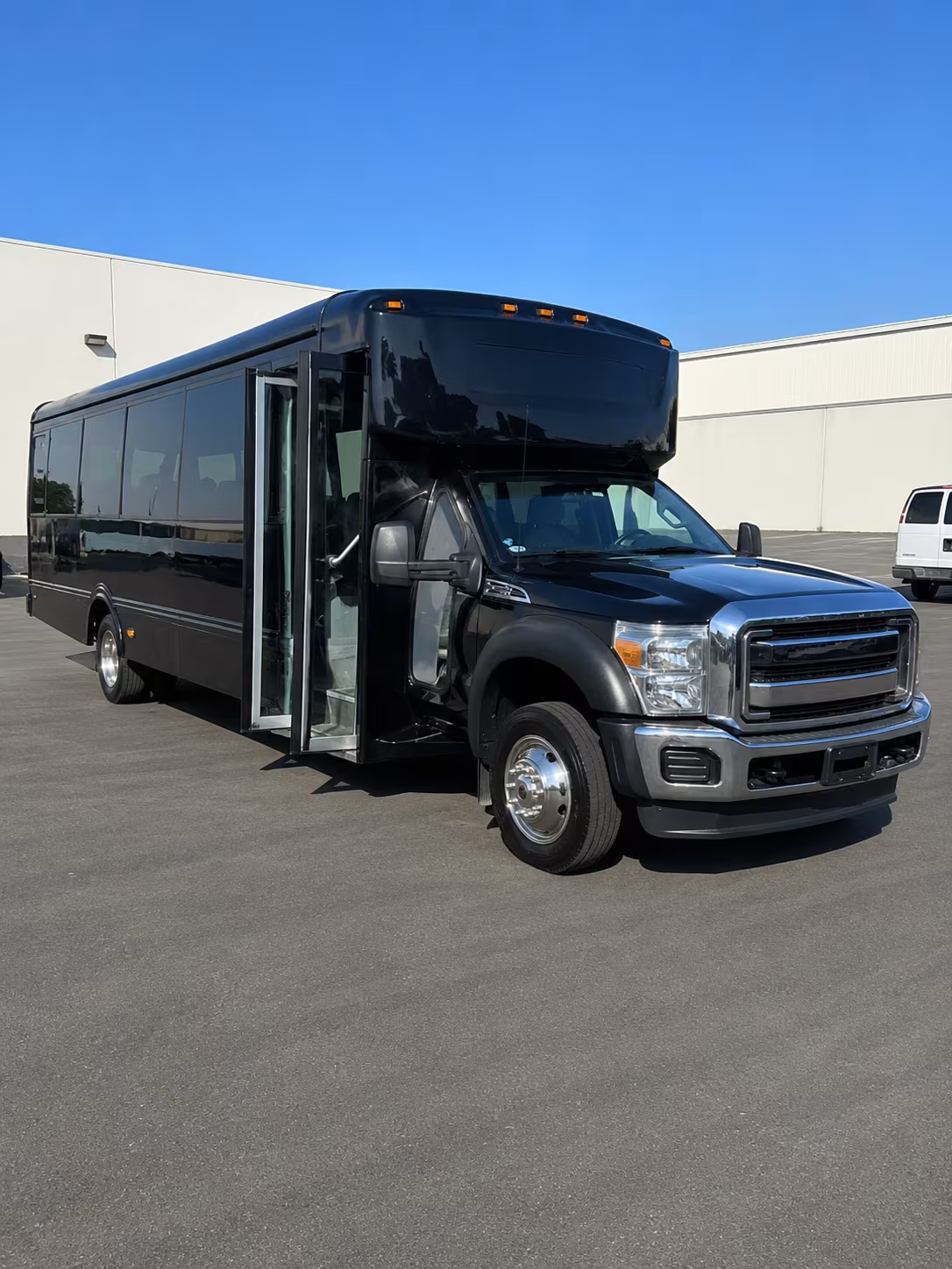 Group beside a Mercedes Sprinter limo in Tucson